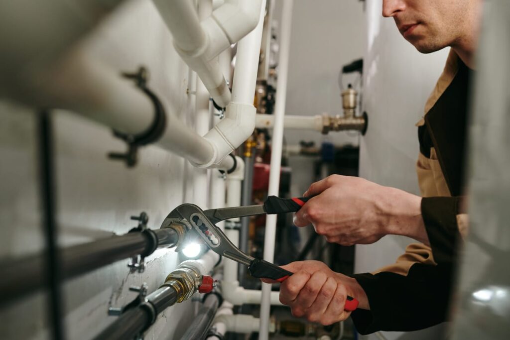 Plumbers maintaining commercial plumbing pipes in Imperial Beach