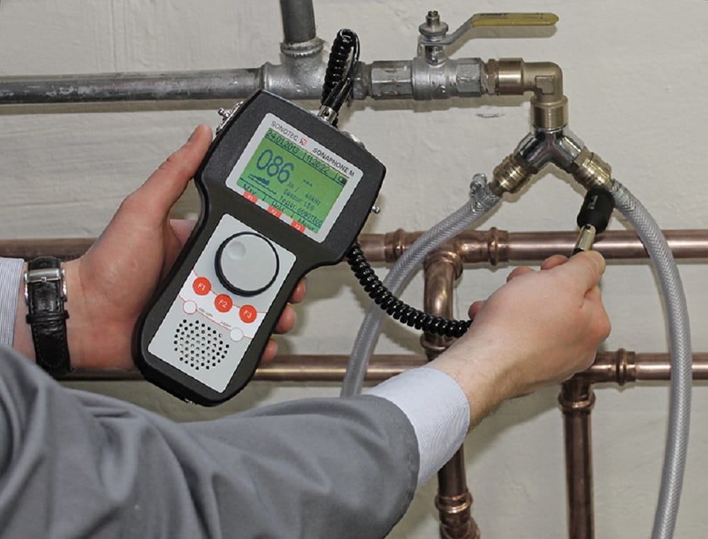 Plumber testing pipes with electronic leak detection equipment in Imperial Beach