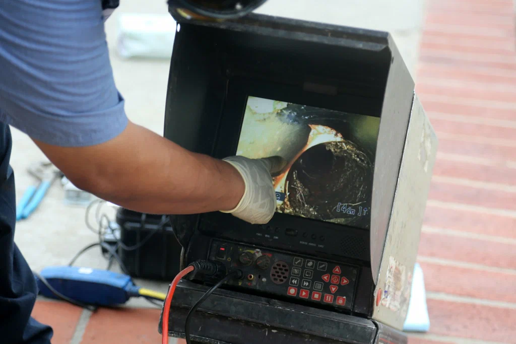 Technician viewing a drain inspection camera in Imperial Beach